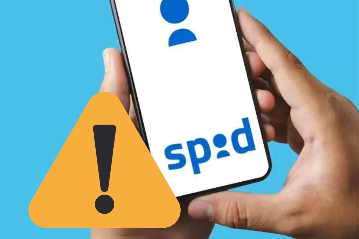 mani con telefono e logo spid con segnale di pericolo
