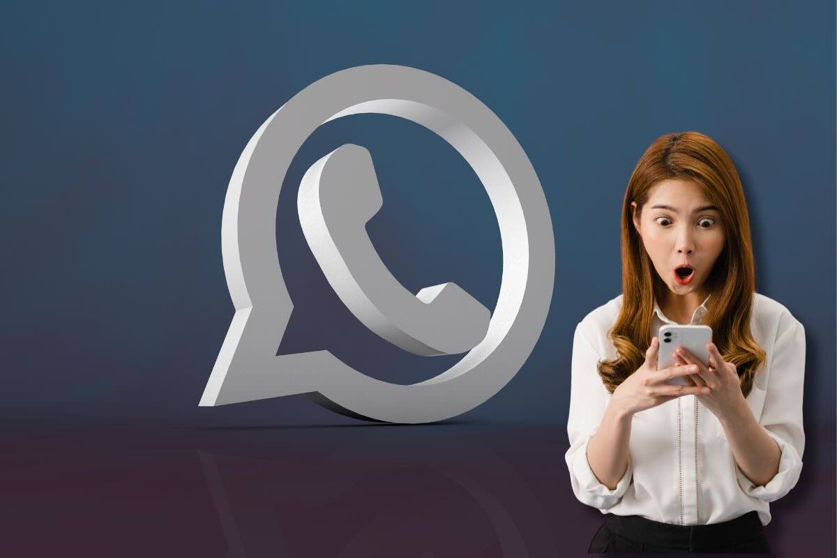 Logo Whatsapp, donna stupita guarda smartphone