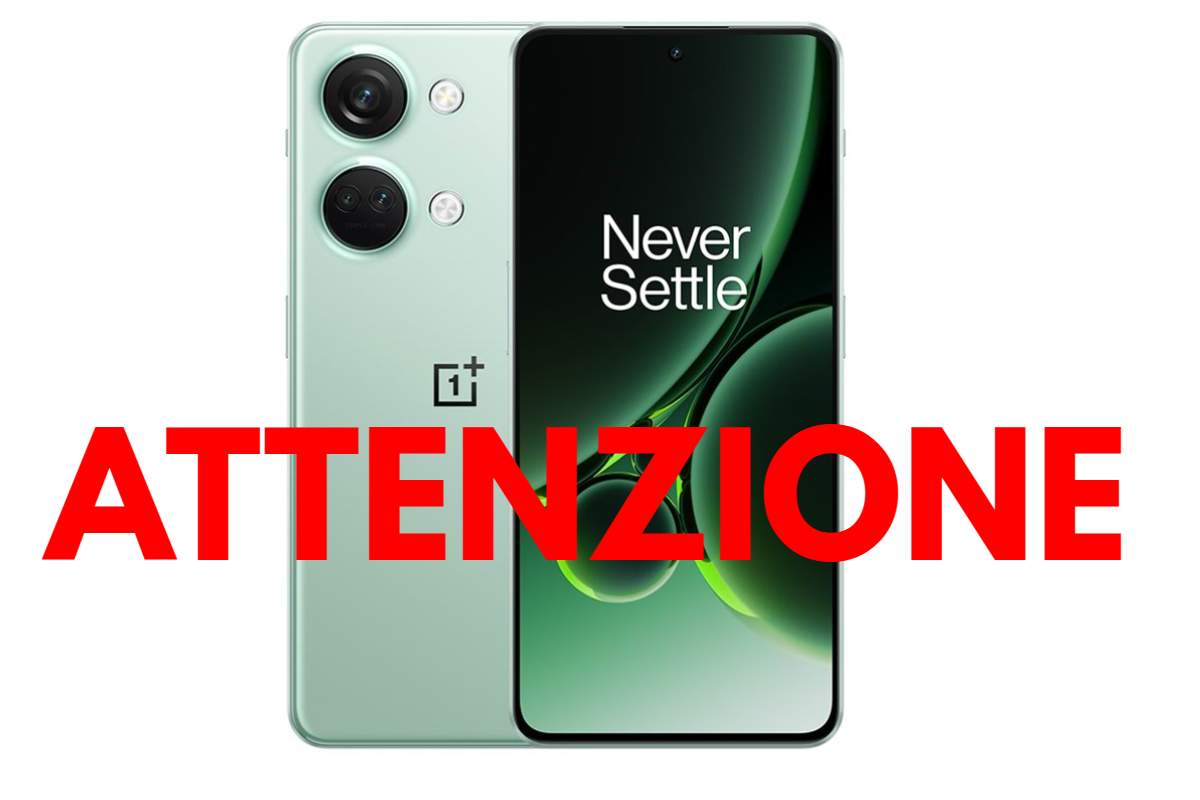 smartphone oneplus con attenzione scritto in rosso